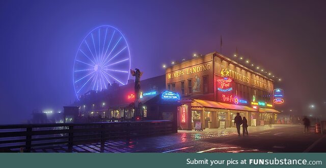 (OC) Seattle ferris wheel on the waterfront during a fog