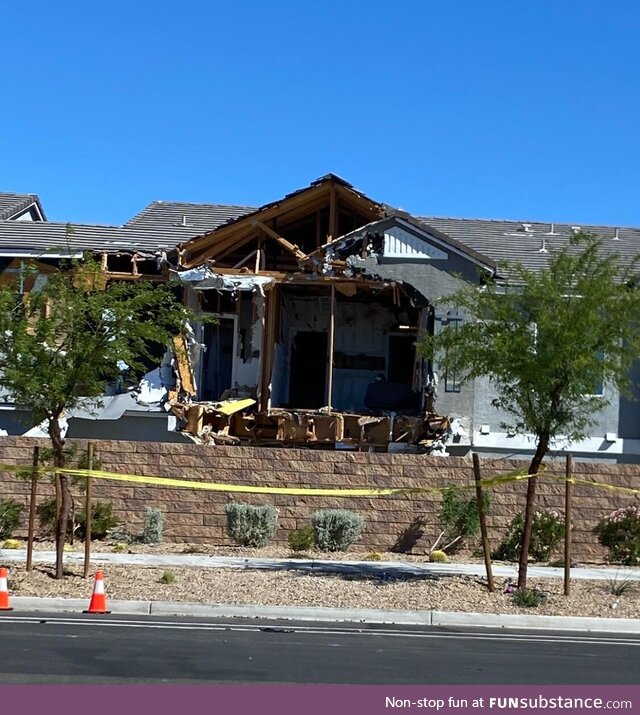 The townhouse down the street after SWAT used an excavator to attempt to apprehend their