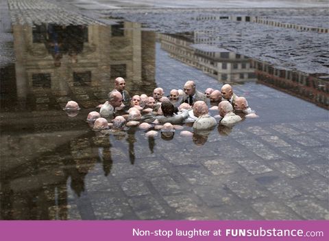 Isaac Cordal sculpture depicting politicians discussing global warming