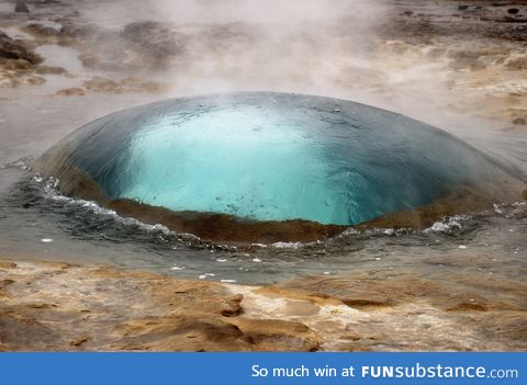 Geyser in Strokkur, Iceland seconds before eruption