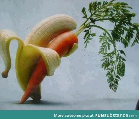 A banana, tenderly holding a carrot