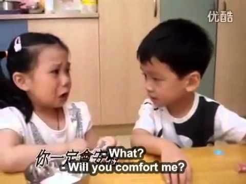 Cute taiwanese boy comforts girl on first day if school