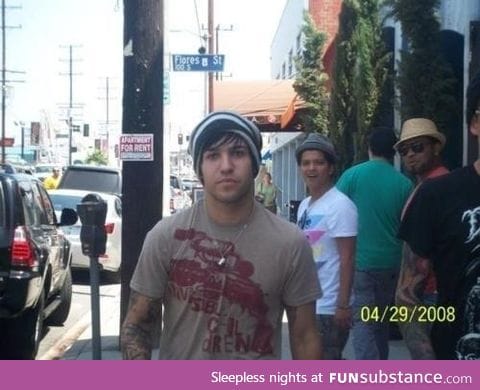 Pete Wentz photobombed by Bruno Mars