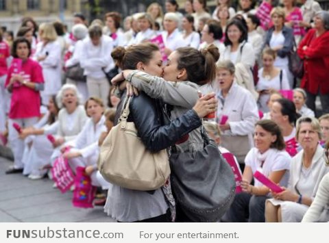 Brave lesbians kissing during a homophobic event
