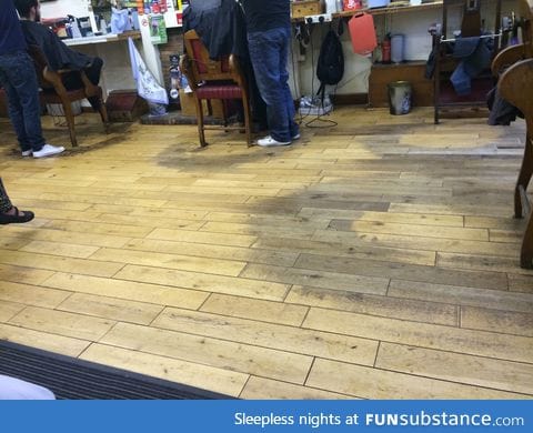 Barbershop floor worn away after decades of barbering