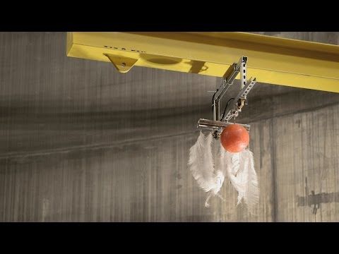 What happens when you drop a bowling ball and feather in the biggest vacuum chamber