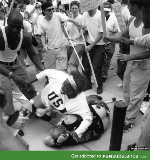 Woman saves racist man from mob