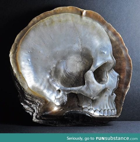 A skull carved from mother of pearl by Gregory Halili