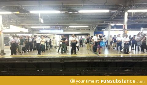 Tokyo commuters waiting for their train