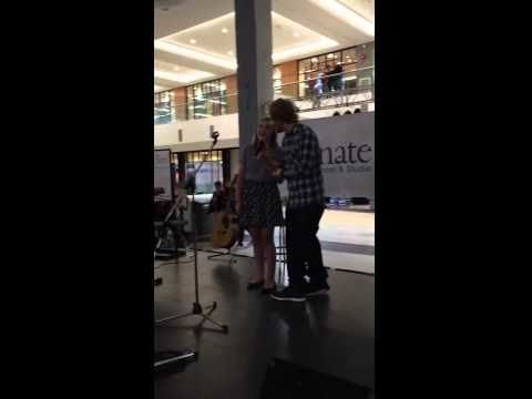 Ed Sheeran hears his song being sung in a mall by a young girl and decides to join in