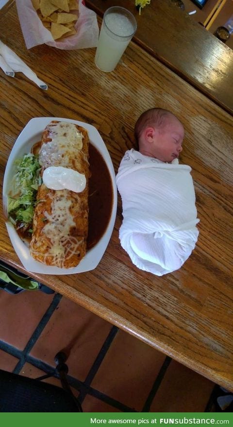 Baby burrito-ed next to a baby sized burrito for scale
