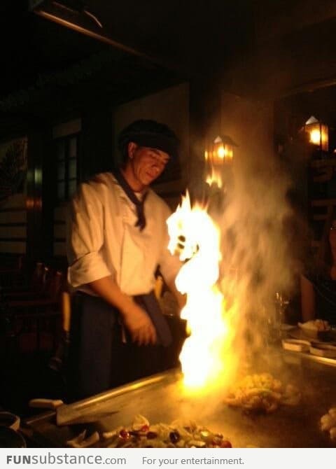 A dragon rises from the flames
