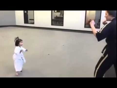Cute karate kid seriously recites her karate vows