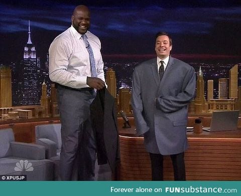 Jimmy Fallon wearing Shaq's jacket