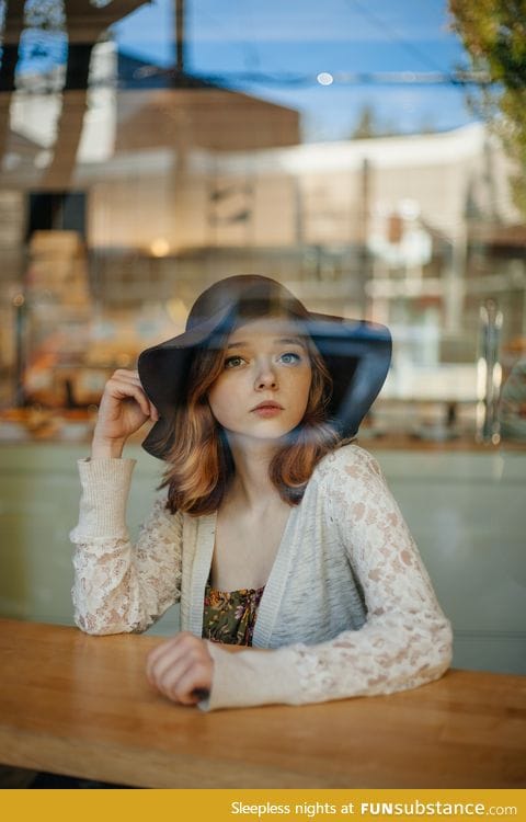 Girl behind a cafe window