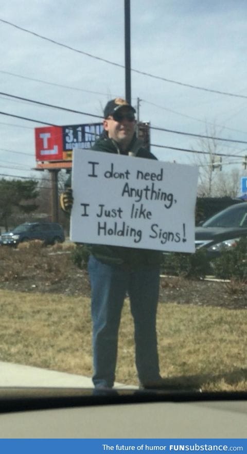 Most guys holding a sign on a street corner don't make me smile
