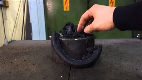 Crushing hockey puck with hydraulic press