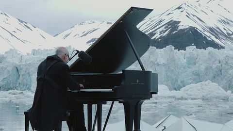 Pianist performs in the Arctic while glaciers collapse behind him