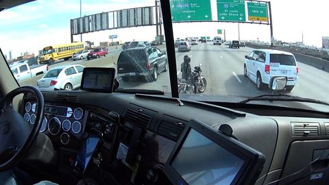 Trucker helps motorcyclist get to the side of the road