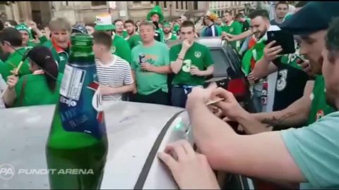 Ireland fans dented the roof of a French car, gave some money, fixed it, then celebrated