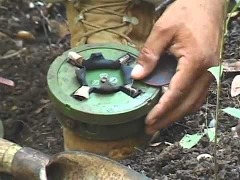 Cambodian man shows how to disarm a landmine