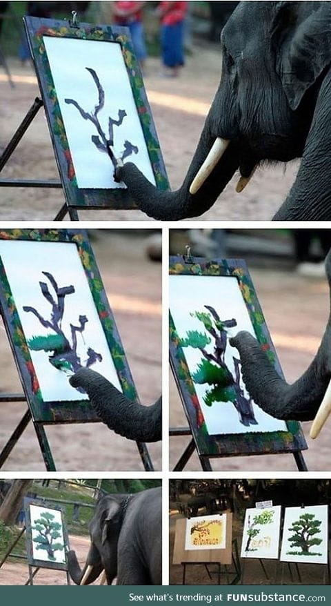 Elephant painting a tree