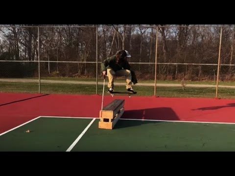 Blind skateboarder using his cane