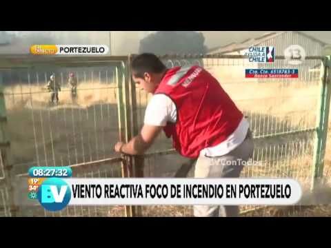 Guy rushes to open gate for firefighters as wind rises a forest fire in Chile