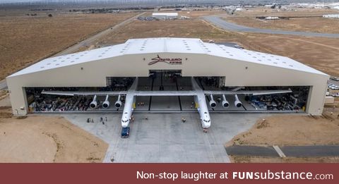 The largest aircraft in the world rolling out of it's hangar in Mojave CA