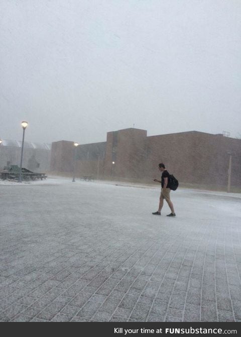 A guy at a University in Canada walking to class