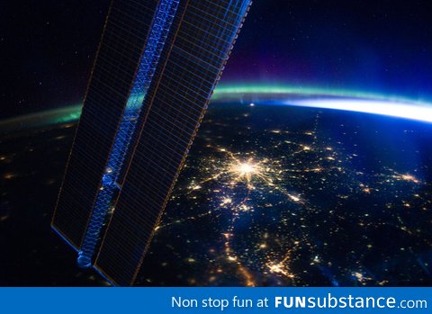 Moscow at night as seen from the ISS, with Aurora Borealis in the background
