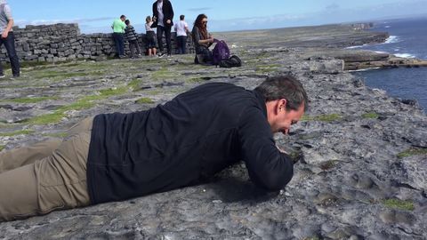 Guy determined to take in the view despite his crippling fear of heights