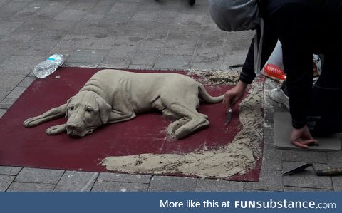 This dog made out of sand. (Germany, Flensburg)
