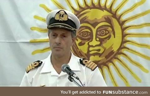 This sun giving a shoulder rub to this navy officer