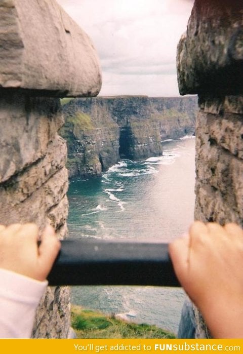 It almost looks like they're holding up a photograph