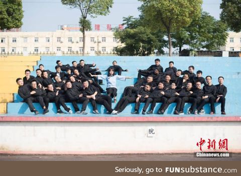 Only girl in an engineering school posing with her other classmates