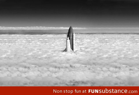 Shuttle breaks clouds