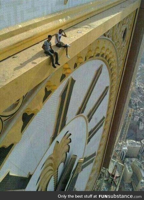 Sitting on top of world's largest clock
