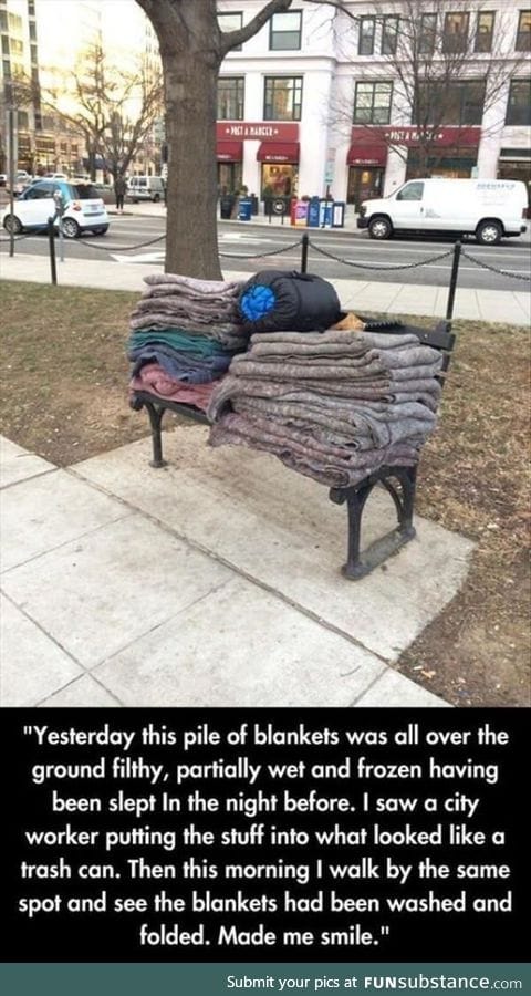 A city worker washes and folds these blankets for the homeless