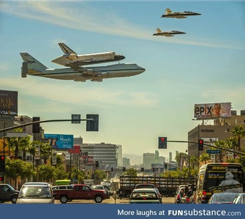 The space shuttle being carried by a 747 and escorted by two F-18's