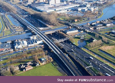 The Netherlands, where you have a bridge for cars, over a bridge for boats, over a road