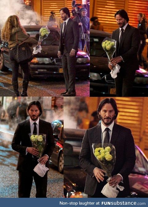 Keanu Reeves getting flowers from a fan