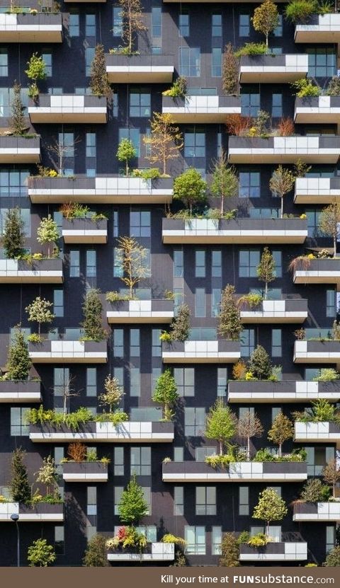 Trees adorn the balconies of this residential tower in Milan