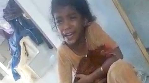 Compassionate Girl Protects a Chicken in India