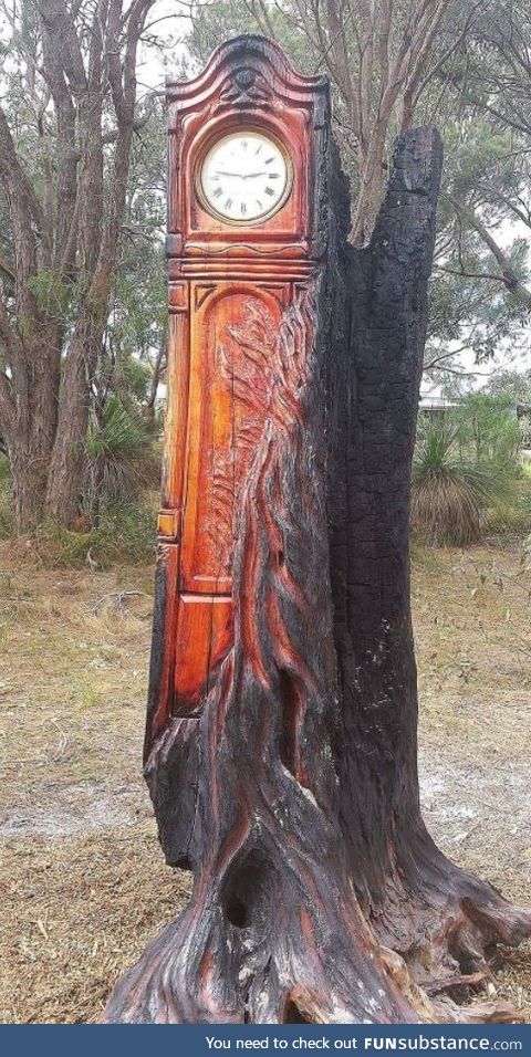 A Grandfather clock made from a burnt tree
