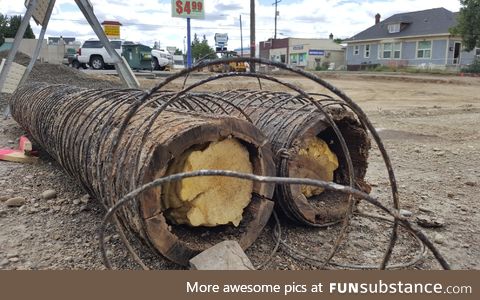 Construction crews working on a stretch of road uncovered old water pipes made of wood