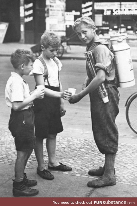 Boy with a portable lemonade stand, 1931