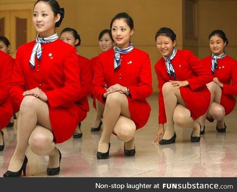 Cathay Pacific flight attendents training elegance when squatting down