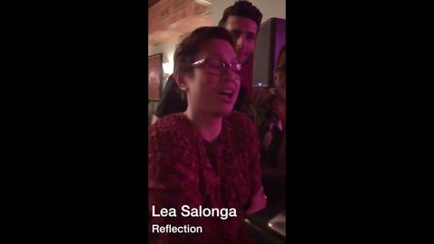 The voice of Mulan and Princess Jasmine, Lea Salonga, singing Reflection in a bar