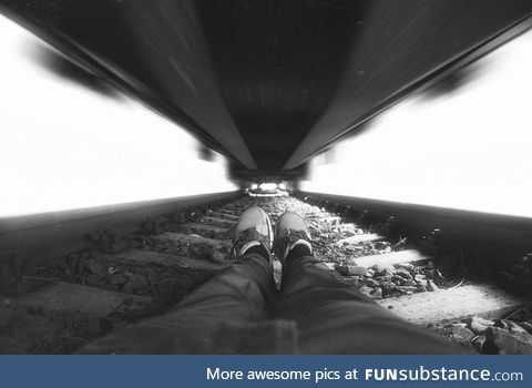 Photographer under train
